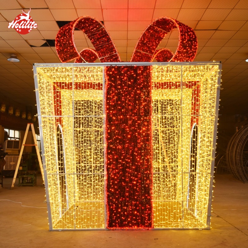 Large outdoor LED gift box arch light sculpture with walk-through design for commercial Christmas decoration