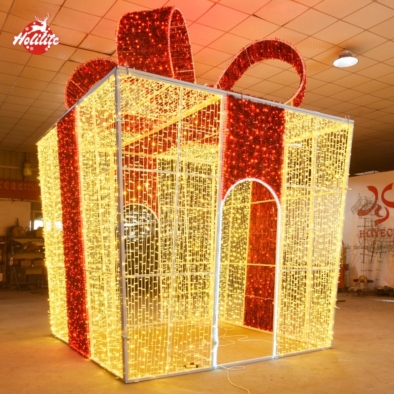 Large outdoor LED gift box arch light sculpture with walk-through design for commercial Christmas decoration