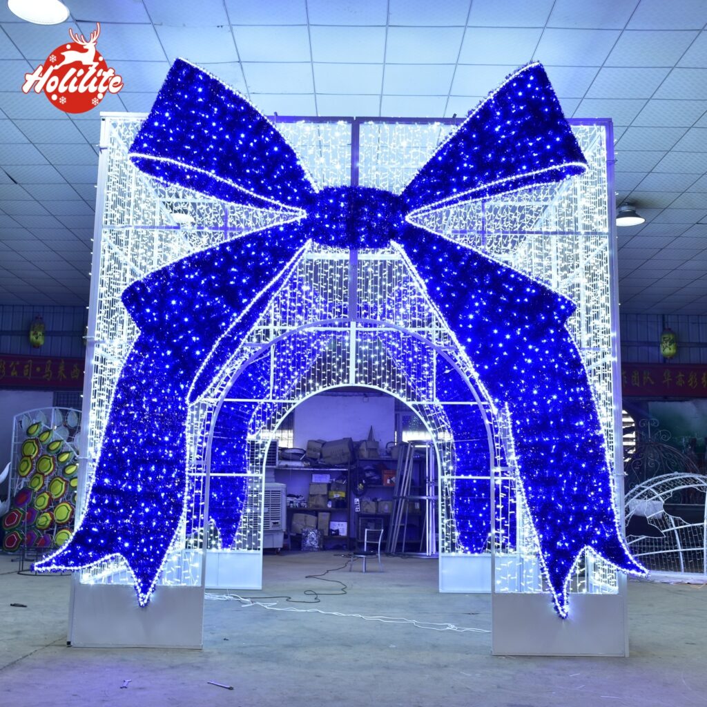 Arco LED exterior para caja de regalo con luz de motivo de lazo azul para instalación comercial navideña