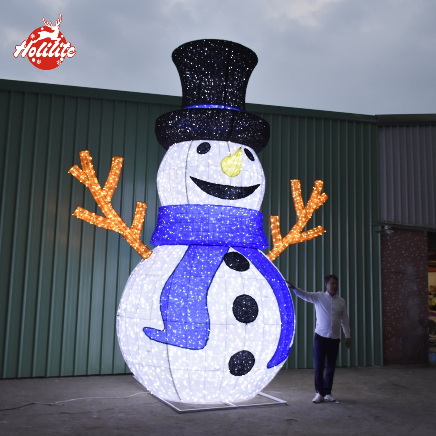 Oversized snowman LED light decoration showing scale comparison for outdoor use