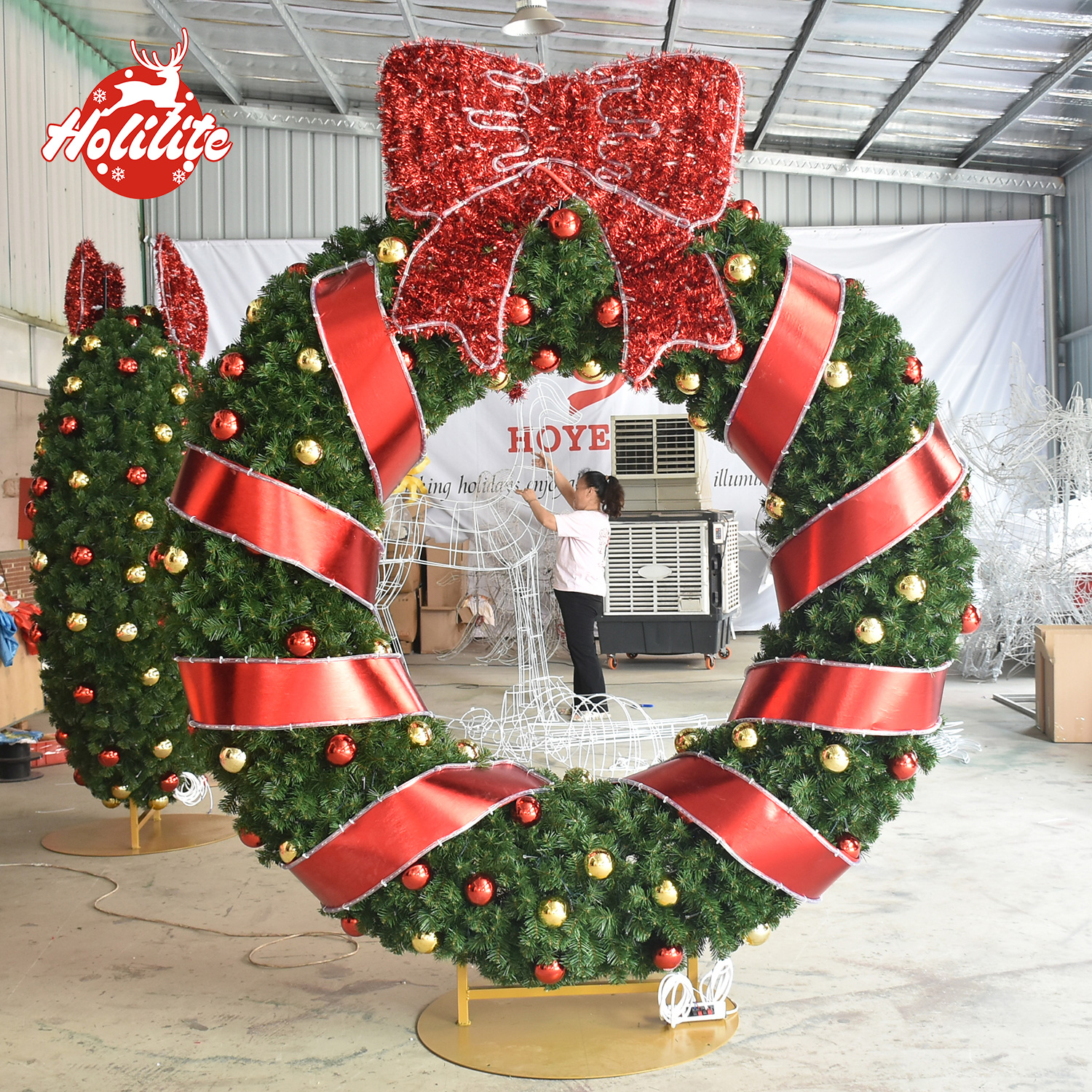 Custom commercial Christmas wreath shown in factory for design and project service
